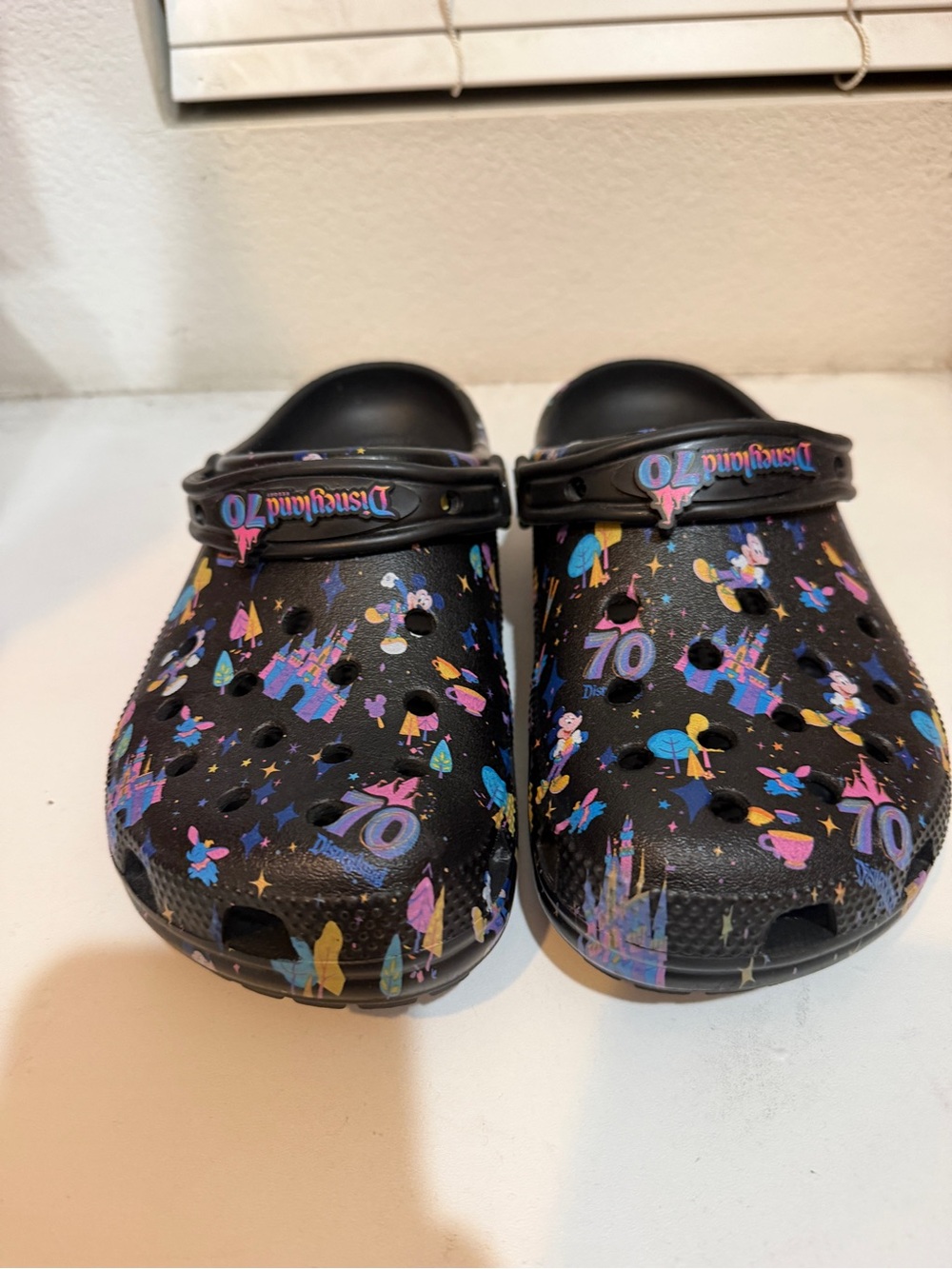 CROCS Kids Black Disney 70th Patterned Clogs with Pink Blue Yellow Accents